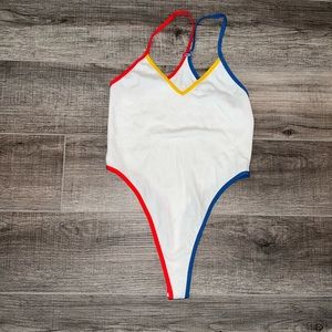 High cut, white blue, yellow and red bodysuit. NWOT